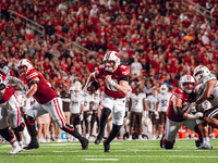 Wisconsin Badgers quarterback Tyler Van Dyke #10 runs for a touchdown against the Western Michigan Broncos at Camp Randall Stadium in Madiso...