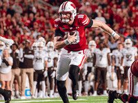 Wisconsin Badgers quarterback Tyler Van Dyke #10 runs for a touchdown against the Western Michigan Broncos at Camp Randall Stadium in Madiso...