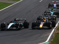 George Russell of Mercedes and Sergio Perez of Red Bull Racing during the Formula 1 Italian Grand Prix at Autodromo Nazionale di Monza in Mo...