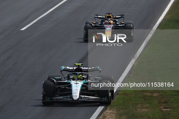 Lewis Hamilton of Mercedes and Max Verstappen of Red Bull Racing during the Formula 1 Italian Grand Prix at Autodromo Nazionale di Monza in...