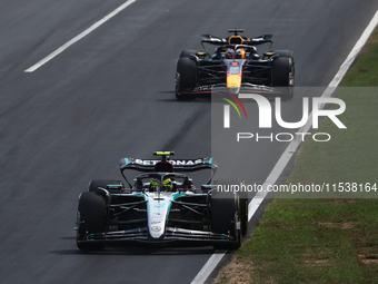 Lewis Hamilton of Mercedes and Max Verstappen of Red Bull Racing during the Formula 1 Italian Grand Prix at Autodromo Nazionale di Monza in...