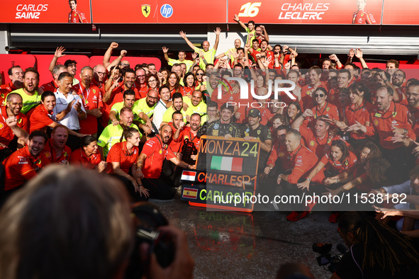 Charles Leclerc and Carlos Sainz of Ferrari celebrate with thier team after Leclerc won the Italian Formula One Grand Prix at Autodromo Nazi...