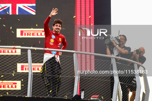 Charles Leclerc of Ferrari celebrates on the podium after winning the Italian Formula One Grand Prix at Autodromo Nazionale Monza circuit, i...