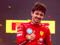 Charles Leclerc of Ferrari celebrates on the podium after winning the Italian Formula One Grand Prix at Autodromo Nazionale Monza circuit, i...