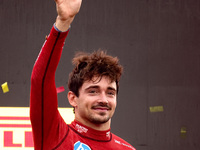 Charles Leclerc of Ferrari celebrates on the podium after winning the Italian Formula One Grand Prix at Autodromo Nazionale Monza circuit, i...