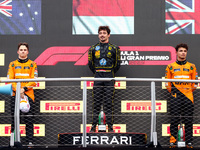 Charles Leclerc of Ferrari, Oscar Piastri of McLaren and Lando Norris of McLaren are seen on the podium after winning the Italian Formula On...