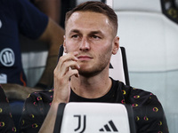 Juventus midfielder Teun Koopmeiners (8) waits on the bench during the Serie A football match number 3 between Juventus and Roma in Turin, P...