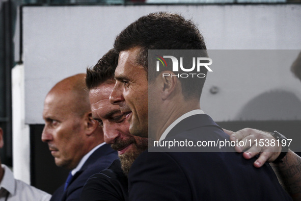 Juventus coach Thiago Motta hugs Roma coach Daniele De Rossi during the Serie A football match number 3 between Juventus and Roma in Turin,...