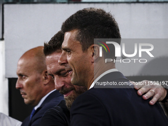 Juventus coach Thiago Motta hugs Roma coach Daniele De Rossi during the Serie A football match number 3 between Juventus and Roma in Turin,...