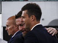 Juventus coach Thiago Motta hugs Roma coach Daniele De Rossi during the Serie A football match number 3 between Juventus and Roma in Turin,...