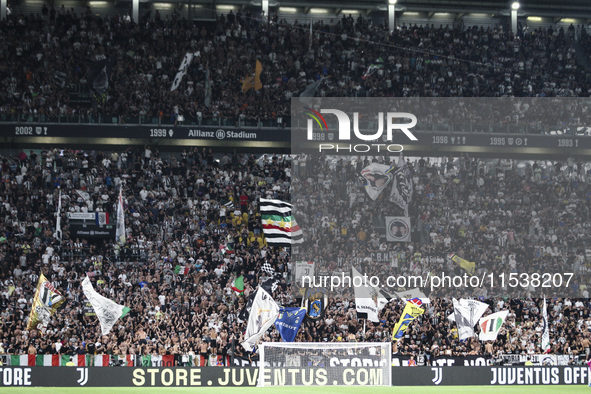 Juventus supporters cheer during the Serie A football match number 3 between Juventus and Roma in Turin, Italy, on September 1, 2024, at the...