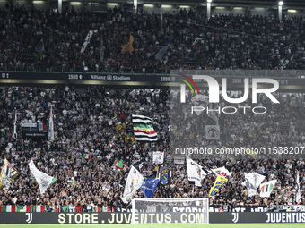 Juventus supporters cheer during the Serie A football match number 3 between Juventus and Roma in Turin, Italy, on September 1, 2024, at the...