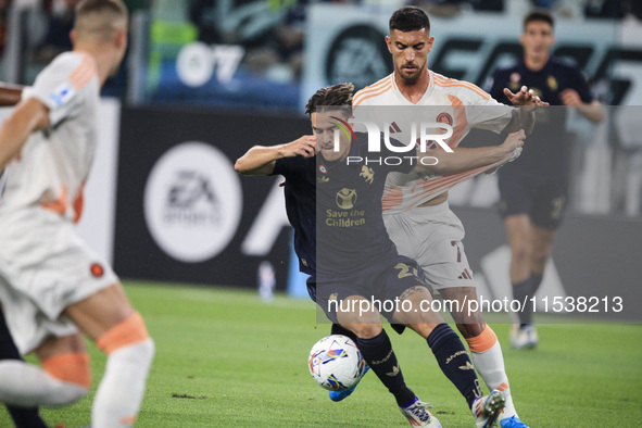 Juventus midfielder Nicolo Fagioli (21) fights for the ball against Roma midfielder Lorenzo Pellegrini (7) during the Serie A football match...