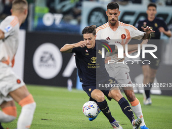 Juventus midfielder Nicolo Fagioli (21) fights for the ball against Roma midfielder Lorenzo Pellegrini (7) during the Serie A football match...