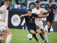 Juventus midfielder Nicolo Fagioli (21) fights for the ball against Roma midfielder Lorenzo Pellegrini (7) during the Serie A football match...