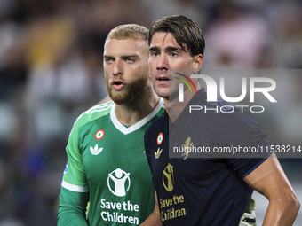 Juventus goalkeeper Michele Di Gregorio (29) and Juventus forward Dusan Vlahovic (9) look on during the Serie A football match n.3 Juventus...