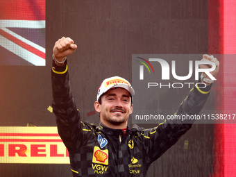 Charles Leclerc of Ferrari celebrates on the podium after winning the Italian Formula One Grand Prix at Autodromo Nazionale Monza circuit, i...