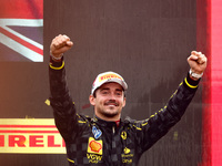 Charles Leclerc of Ferrari celebrates on the podium after winning the Italian Formula One Grand Prix at Autodromo Nazionale Monza circuit, i...