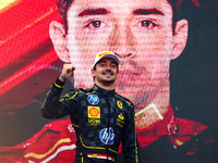 Charles Leclerc of Ferrari celebrates on the podium after winning the Italian Formula One Grand Prix at Autodromo Nazionale Monza circuit, i...