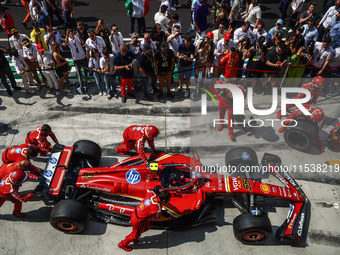 A car of Carlos Sainz of Ferrari is seen in front of a garage ahead of the Italian Formula One Grand Prix at Autodromo Nazionale Monza circu...