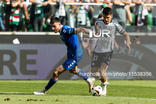 Kaan Caliskaner , Bartosz Kapustka during PKO Ekstraklasa match Legia Warsaw vs Motor Lublin in Warsaw, Poland on 01 September, 2024. 