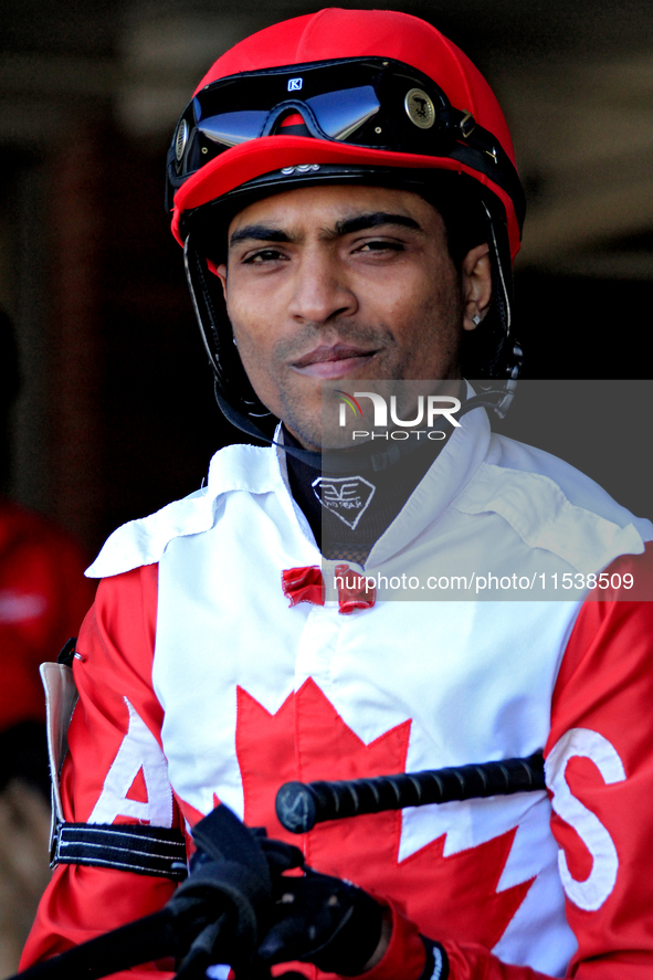 Jockey Steve Jadoo leaves the paddock ahead of the first race at Woodbine Racetrack in Toronto, Canada, on September 1, 2024. 