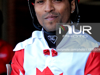 Jockey Steve Jadoo leaves the paddock ahead of the first race at Woodbine Racetrack in Toronto, Canada, on September 1, 2024. (