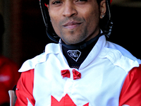 Jockey Steve Jadoo leaves the paddock ahead of the first race at Woodbine Racetrack in Toronto, Canada, on September 1, 2024. (