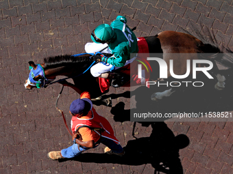 Jockey Keveh Nicholls rides Shameless Affair out of the paddock ahead of the third race at Woodbine Racetrack in Toronto, Canada, on Septemb...