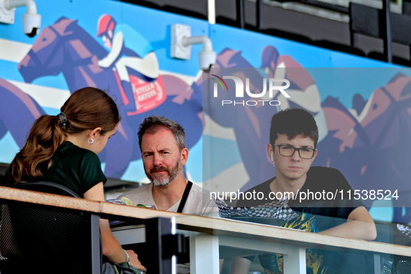 Race fans eat a meal on the Stella Artois Terrace at Woodbine Racetrack in Toronto, Canada, on September 1, 2024. 