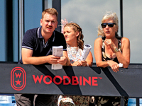 Race fans watch racing at Woodbine Racetrack in Toronto, Canada, on September 1, 2024. (