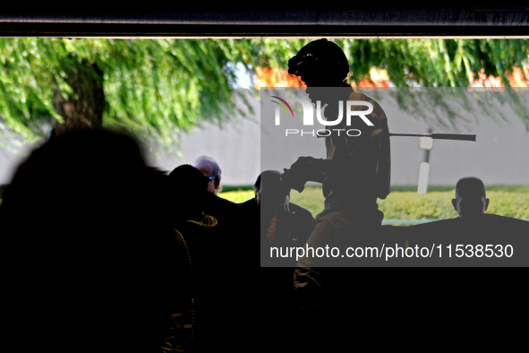 A jockey rides a thoroughbred race horse out of the paddock ahead of a race at Woodbine Racetrack in Toronto, Canada, on September 1, 2024. 