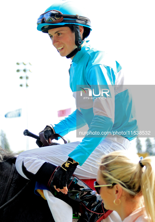 Jockey Pietro Moran rides Ada May to the winner's circle after a win in the fifth race at Woodbine Racetrack in Toronto, Canada, on Septembe...