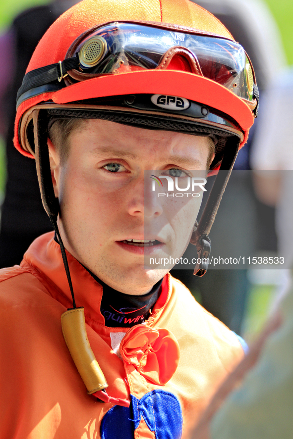 Jockey Austin Adams speaks with connections following the fifth race at Woodbine Racetrack in Toronto, Canada, on September 1, 2024. 