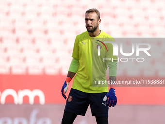 Pau Lopez of Girona FC is in action during the La Liga EA Sports match between Sevilla FC and Girona CF at Nuevo Mirandilla in Seville, Spai...