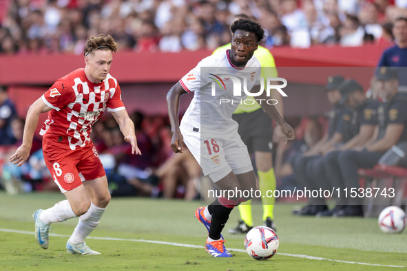 Luciem Agoume of Sevilla FC runs with the ball during the La Liga EA Sports match between Sevilla FC and Girona CF at Nuevo Mirandilla in Se...