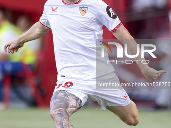 Valentin Barco of Sevilla FC makes a center to the area during the La Liga EA Sports match between Sevilla FC and Girona CF at Nuevo Mirandi...