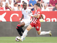 Dodi Lukebakio of Sevilla FC runs with the ball during the La Liga EA Sports match between Sevilla FC and Girona CF at Nuevo Mirandilla in S...