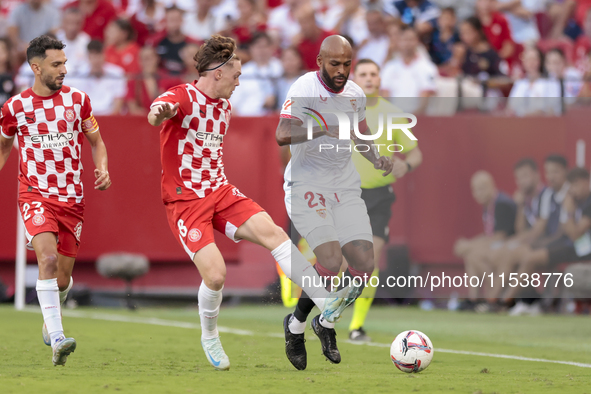 Marcos do Nascimento ''Marcao'' of Sevilla FC battles for the ball during the La Liga EA Sports match between Sevilla FC and Girona CF at Nu...