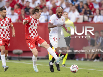 Marcos do Nascimento ''Marcao'' of Sevilla FC battles for the ball during the La Liga EA Sports match between Sevilla FC and Girona CF at Nu...