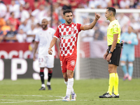 Ivan Martin of Girona FC celebrates a goal during the La Liga EA Sports match between Sevilla FC and Girona CF at Nuevo Mirandilla in Sevill...