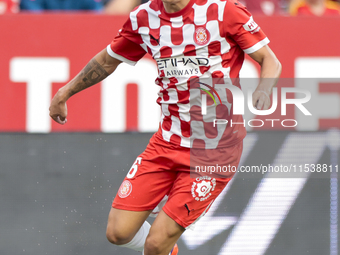 Alejandro Frances of Girona FC runs with the ball during the La Liga EA Sports match between Sevilla FC and Girona CF at Nuevo Mirandilla in...