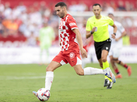 Abel Ruiz of Girona FC runs with the ball during the La Liga EA Sports match between Sevilla FC and Girona CF at Nuevo Mirandilla in Seville...