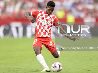 Yaser Asprilia of Girona FC makes a center to the area during the La Liga EA Sports match between Sevilla FC and Girona CF at Nuevo Mirandil...