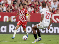 Bryan Gil of Girona FC runs with the ball during the La Liga EA Sports match between Sevilla FC and Girona CF at Nuevo Mirandilla in Seville...