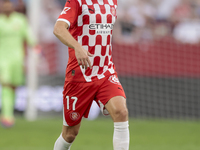 Daley Blind of Girona FC runs with the ball during the La Liga EA Sports match between Sevilla FC and Girona CF at Nuevo Mirandilla in Sevil...