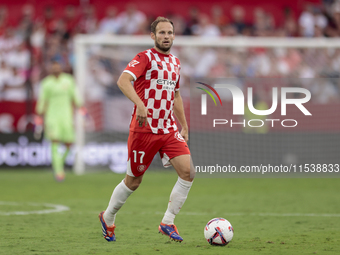 Daley Blind of Girona FC runs with the ball during the La Liga EA Sports match between Sevilla FC and Girona CF at Nuevo Mirandilla in Sevil...