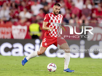 David Lopez of Girona FC passes the ball during the La Liga EA Sports match between Sevilla FC and Girona CF at Nuevo Mirandilla in Seville,...