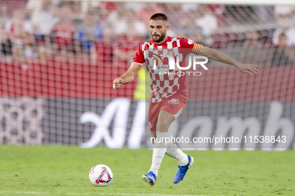 David Lopez of Girona FC passes the ball during the La Liga EA Sports match between Sevilla FC and Girona CF at Nuevo Mirandilla in Seville,...