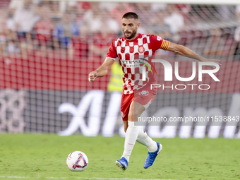 David Lopez of Girona FC passes the ball during the La Liga EA Sports match between Sevilla FC and Girona CF at Nuevo Mirandilla in Seville,...